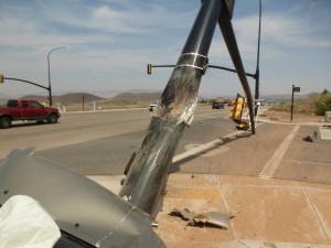 A man was transported to the hospital after falling asleep and crashing his car into a traffic signal pole at 2260 West State Street, causing it to fall over, Hurricane, Utah, Aug. 19, 2015 | Photo courtesy of the Hurricane City Police Department, St. George News