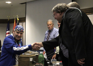 2015 Special Olympics World Games Gold Medal winner Linda Pate shakes hands with Cedar City Councilman Ron Adams,  Cedar City Council Chambers, Cedar City, Utah, August 12, 2015 | Photo by Carin Miller, St. George News