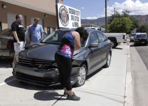 A silver Dodge Intrepid swerved for unknown reasons, crossing their lane and running up the curb into a parked car, the area of 700 West and 400 North, Cedar City, Utah, August 27, 2015 | Photo by Carin Miller, St. George News