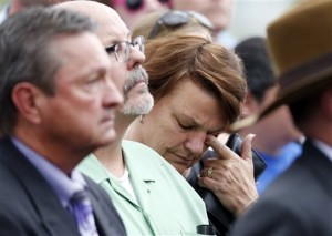 A woman who accompanied Tom Sullivan, who lost his son, Alex, in the massacre in an Aurora, Colo., theatre in July 21012, wipes tears outside the Arapahoe County Courthouse after a jury failed to agree on whether theater shooter James Holmes should get the death penalty, Centennial, Colo.,  Aug. 7, 2015 |  AP Photo by David Zalubowski, St. George News