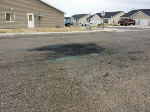 A charred spot is left on the road where a vehicle fire in Cedar City, Utah, Aug. 1, 2015 | Photo by David Juarez, St. George News