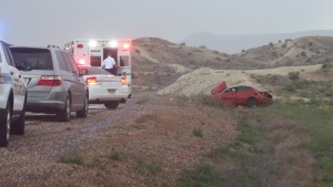 Police say the driver of the car was distracted by watching lightning, causing him to drift off the road and roll the car. The driver and passenger in the car – both juveniles – wearing wearing their seat belts and received only a few bumps and bruises, St. George Police Sgt. Dave Williams said, St. George, Utah, Aug. 14, 2015 | Photo by Mori Kessler, St. George News