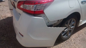 A Nissan was damaged after the car it was driving behind made a sudden u-turn, causing the cars behind it to slam their brakes, Washington, Utah, August 20, 2015 | Photo by Nataly Burdick, St. George, Utah