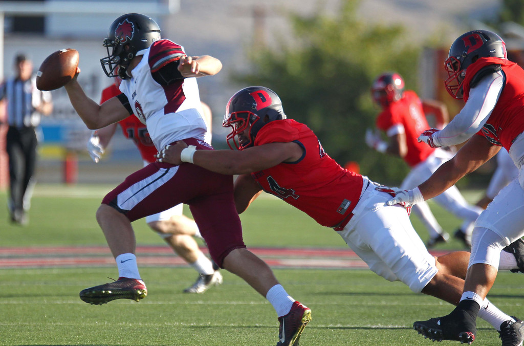 Dixie State defender Keanu Foki takes down the Central Washington quarterback, Dixie State University vs. Central Washington University, St. George, Utah, Sept. 10, 2015, | Photo by Robert Hoppie, ASPpix.com, St. George News