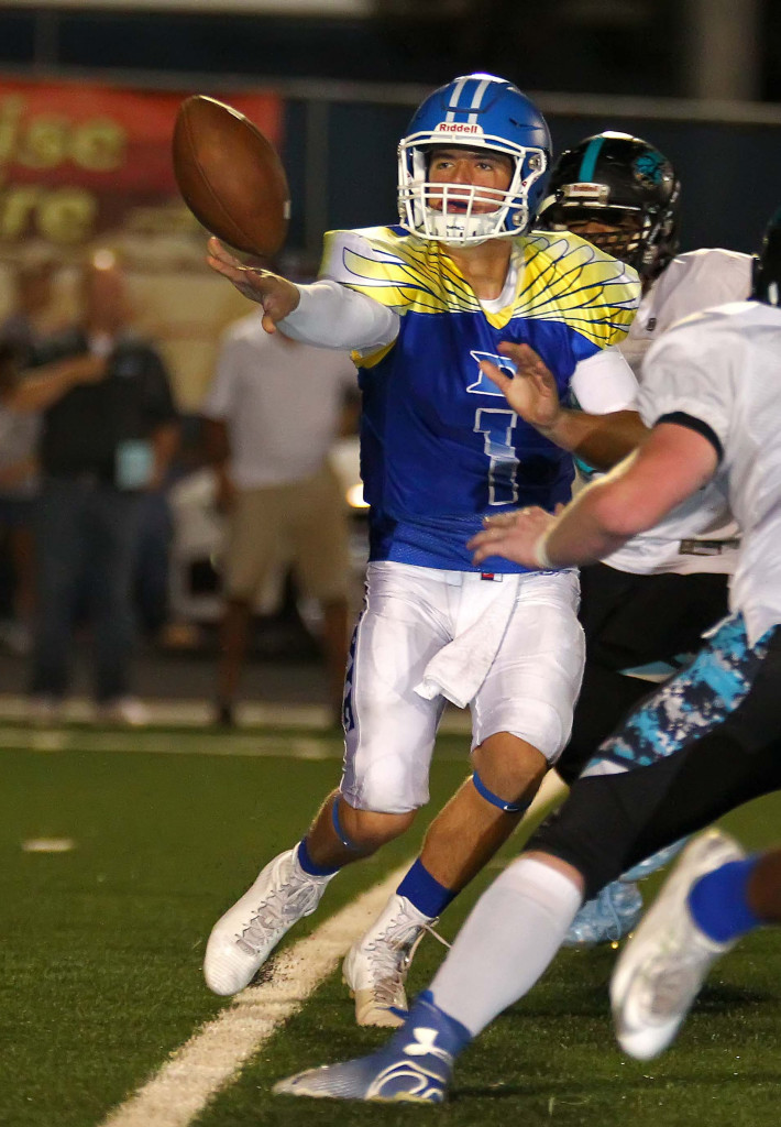 Dixie quarterback Zac Harrah (1) makes a pitch, Dixie vs. Canyon View, Football, St. George, Utah, Sept. 11, 2015, | Photo by Robert Hoppie, ASPpix.com, St. George News