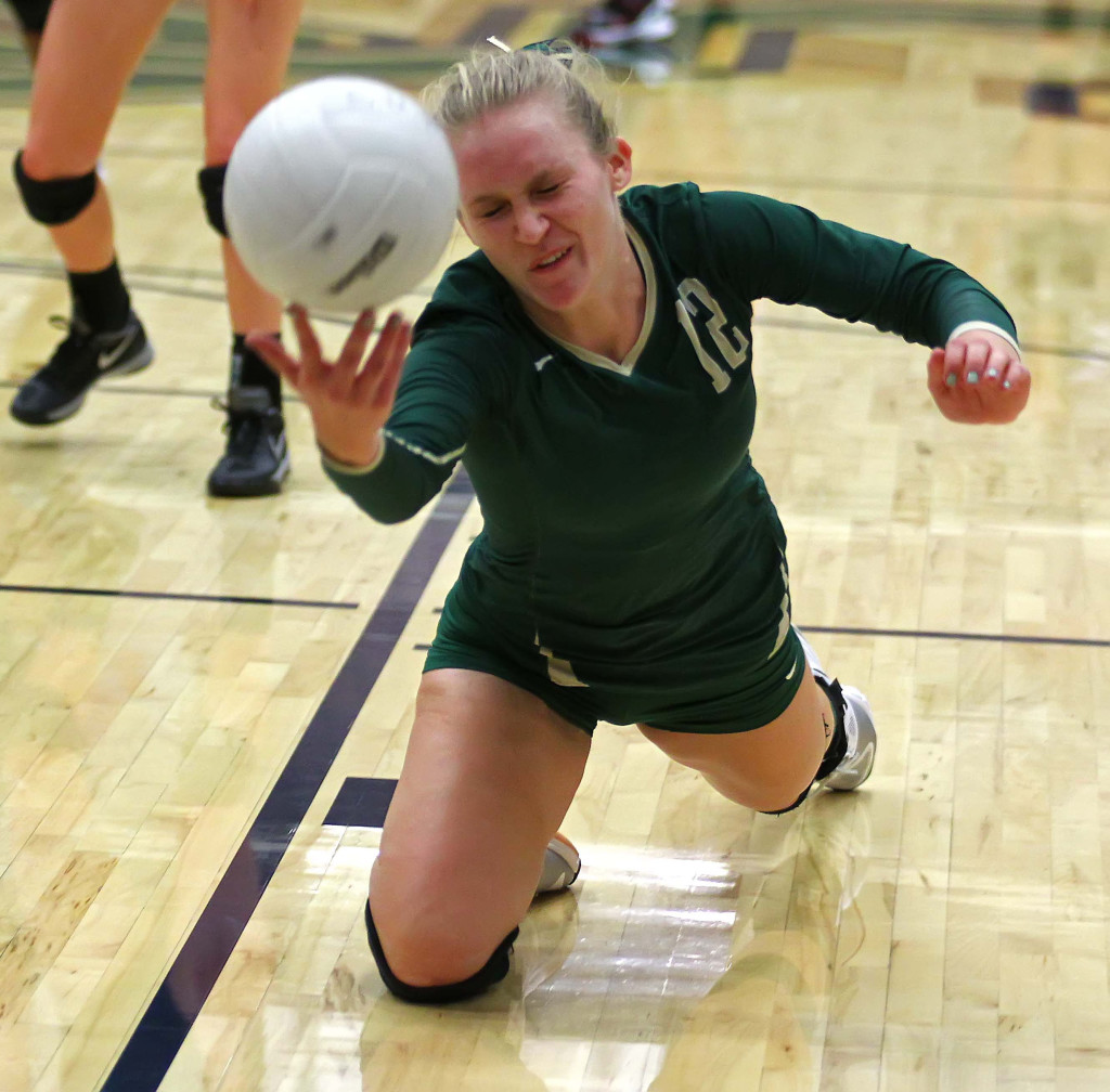 Shaylee Reed (12) dives for a ball for the Lady Warriors, Snow Canyon vs. Hurricane, Volleyball, St. George, Utah, Sept. 29, 2015, | Photo by Robert Hoppie, ASPpix.com, St. George News