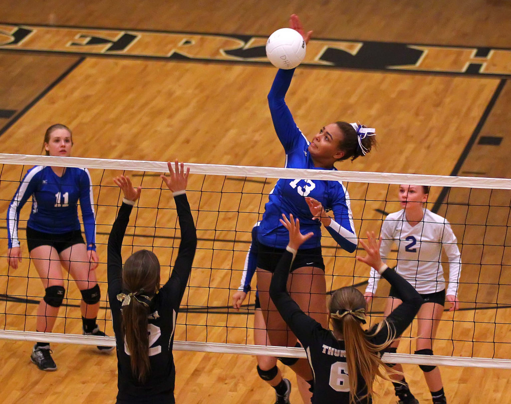 DeAubrey Bowers (13 with a spike for Dixie, Desert Hills vs. Dixie, Volleyball, St. George, Utah, Sept. 17, 2015, | Photo by Robert Hoppie, ASPpix.com, St. George News