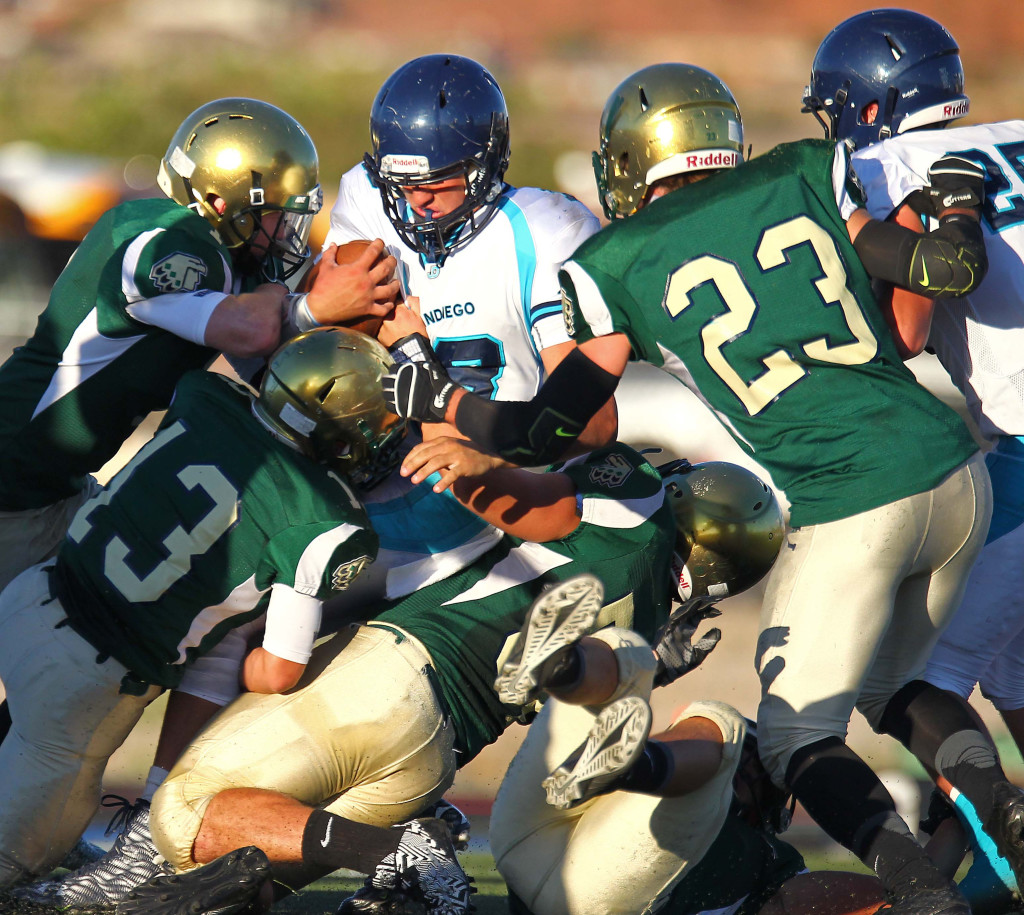 The Warrior defense stacks up the Juan Diego ball carrier, Snow Canyon vs. Juan Diego, Football, St. George, Utah, Sept. 4, 2015, | Photo by Robert Hoppie, ASPpix.com, St. George News