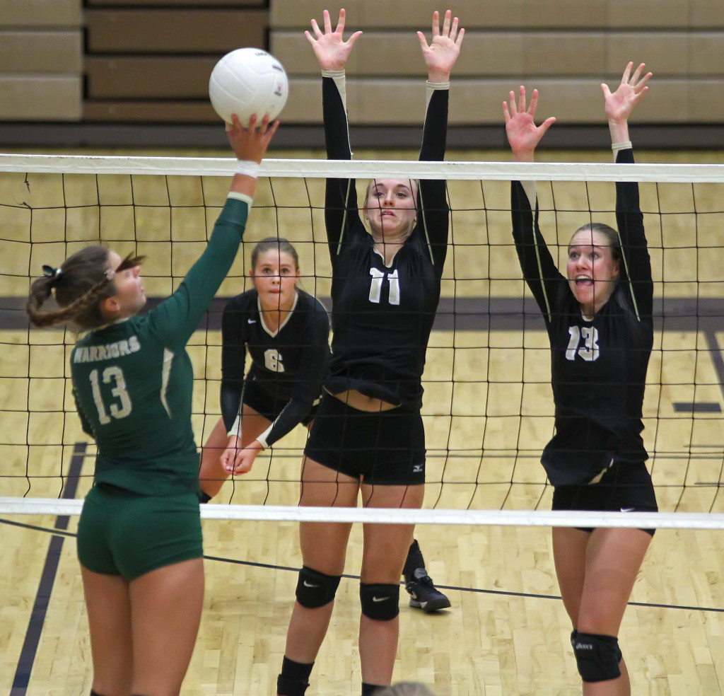 Snow Canyon's Alexa Parker (13) and Desert Hills' Jenny Harris (11) and Jessica Harris (13), Snow Canyon vs. Desert Hills, Volleyball, St. George, Utah, Sept. 24, 2015, | Photo by Robert Hoppie, ASPpix.com, St. George News