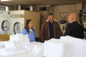 Travel Channel's "Hotel Impossible" host Anthony Melchiorri meets with employees of the Stratford Court Hotel’s housekeeping department, to get more insight into the hotel’s operations, Stratford Court Hotel, Cedar City, Utah, March 2014 | Photo courtesy of Travel Channel, St. George News
