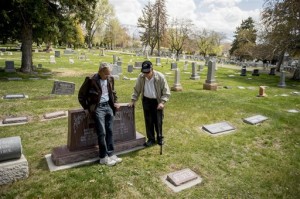 Cousins Merlin Morrison, 80, and John Arling Morrison, 84, talk at the gravesite of their grandparents John G. and Marie Morrison in the Salt Lake City Cemetery. Industrial Workers of the World songwriter Joe Hill was convicted of the Jan. 10, 1914, murder of John Morrison and executed at the Utah State Prison, Salt Lake City Cemetery, April 9, 2015 | AP Photo by Jeremy Harmon, The Salt Lake Tribune JOEHILL.SLTRIB.COM, St. George News 