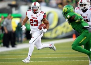 Utah running back Devontae Booker (23) carries the ball during the first half of an NCAA college football game against Oregon, Saturday, Sept. 26, 2015, in Eugene, Ore. (AP Photo/Ryan Kang)