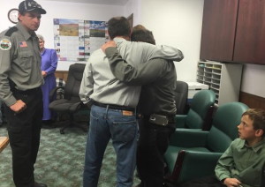 Utah Gov. Gary Herbert embracing Sheldon Black, Jr. (L-R) at the Hildale City Hall. Black lost his wife and two children in Monday's fatal flash flooding. Two of Black's sons survived the flooding, while another, 6-year-old Tyson, remains missing, Hildale, Utah, Sept. 19, 2015 | Photo courtesy of the Office of the Governor St. George News