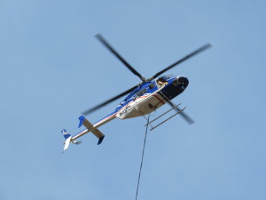 A Bell 407 carries a bucket that holds up to 240 gallons of water. This type of aircraft is also being used to fight the Oak Grove Fire, time and location unknown | Photo courtesy of the U.S. Forest Service, St. George News