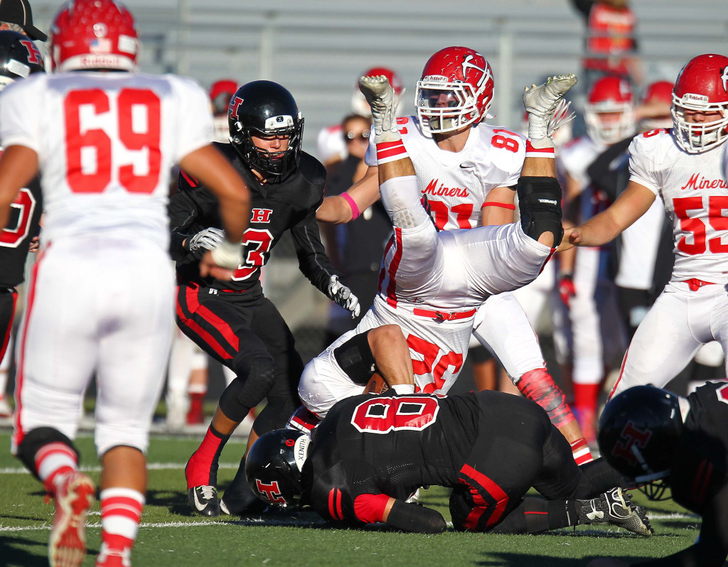 The Hurricane defense up-ends the Park City ball carrier, Hurricane vs. Park City, 3AA Football Playoffs, Utah, Oct. 30, 2015, | Photo by Robert Hoppie, ASPpix.com, St. George News