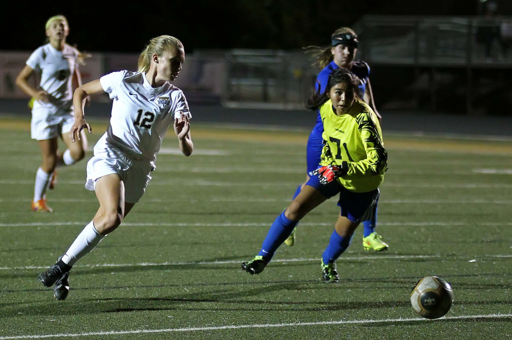 Brooklyn Lott (12) slips past the Richfield goalkeeper and scores for the Lady Thunder, Desert Hills vs. Richfield, Girls Soccer, St. George, Utah, Oct. 14, 2015, | Photo by Robert Hoppie, ASPpix.com, St. George News