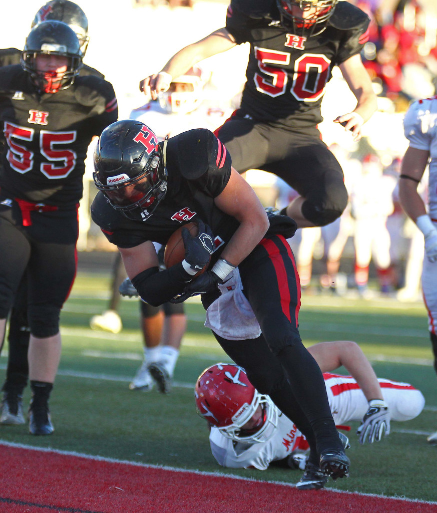 Hurricane's Jacob Carr (1) breaks a couple of tackles and scores a touchdown, Hurricane vs. Park City, 3AA Football Playoffs, Utah, Oct. 30, 2015, | Photo by Robert Hoppie, ASPpix.com, St. George News