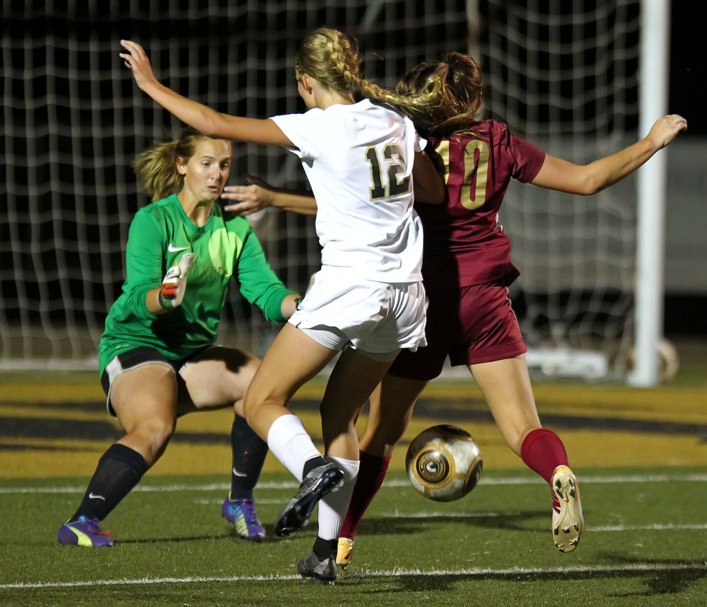 Desert Hills' Brooklyn Lott (12) puts pressure on the Cedar goalkeeper, Cedar vs. Desert Hills, Girls Soccer, St. George, Utah, Oct. 6, 2015, | Photo by Robert Hoppie, ASPpix.com, St. George News