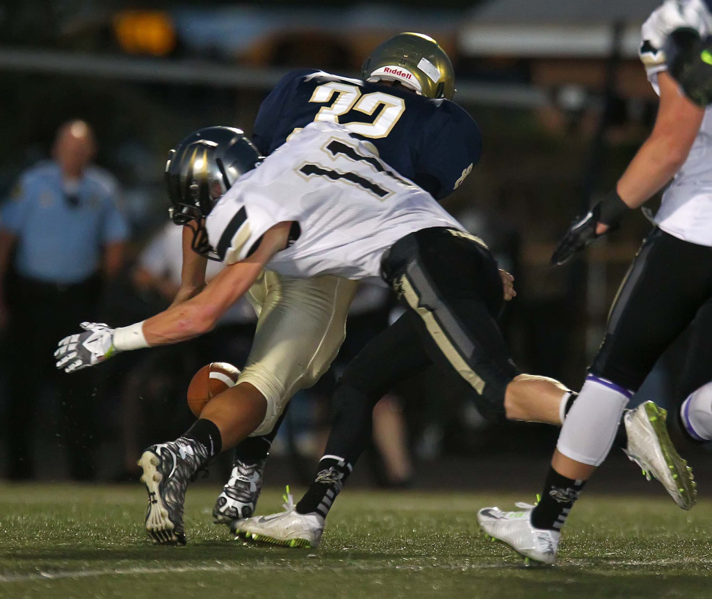 Ryan Hoppie (11) strips the ball from Kody Jacobsen (32), the Thunder would recover, Snow Canyon vs. Desert Hills, Football, St. George, Utah, Oct. 8, 2015, | Photo by Robert Hoppie, ASPpix.com, St. George News