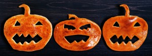 Halloween pumpkin of dough on the wooden table