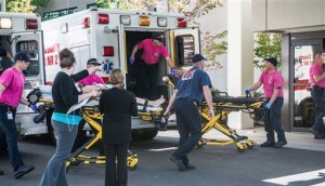 A patient is wheeled into the emergency room at Mercy Medical Center in Roseburg, Ore., following a deadly shooting at Umpqua Community College, in Roseburg, Thursday, Oct. 1, 2015. | Photo by Aaron Yost, Roseburg News-Review via AP, St. George News