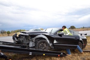 A vehicle is towed from the scene of an accident on I-15 near Cedar City Sunday, Cedar City, Utah, Oct. 18, 2015 | Photo by Emily Hammer, St. George News