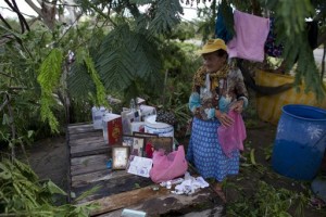 Maria del Refugio Ruiz Bravo sets out to dry personal belongings soaked by Hurricane Patricia, in La Fortuna, Mexico. Record-breaking Patricia pushed rapidly inland over mountainous western Mexico early Saturday, weakening to tropical storm force while dumping torrential rains that authorities warned could cause deadly floods and mudslides, La Fortuna, Mexico, Oct. 24, 2015 | AP Photo/Rebecca Blackwell, St. George, News