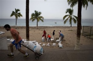 Residents prepare for the arrival of Hurricane Patricia filling sand bags to protect beachfront businesses in Puerto Vallarta, Mexico. Patricia barreled toward southwestern Mexico Friday as a monster Category 5 storm, the strongest ever in the Western Hemisphere. Locals and tourists were either hunkering down or trying to make last-minute escapes ahead of what forecasters called a "potentially catastrophic landfall" later in the day, Puerto Vallarta, Mexico Oct. 23, 2015 | AP Photo/Rebecca Blackwell, St. George News 