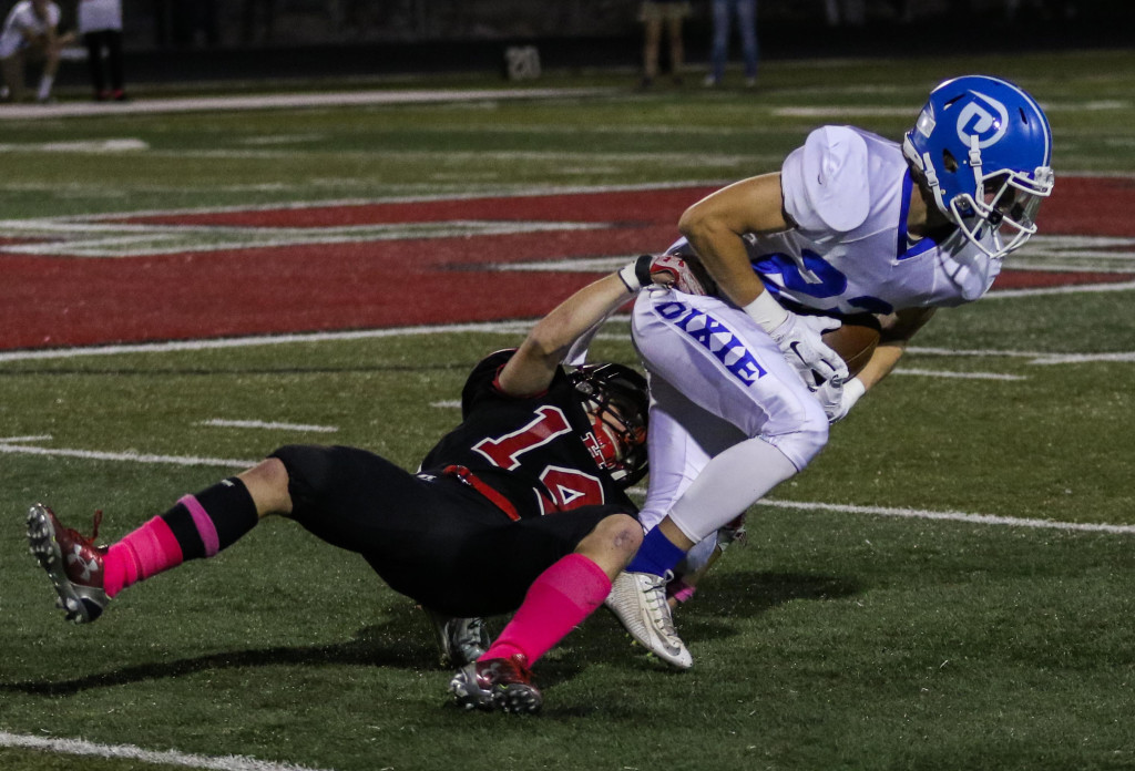 Dixie's Mark Abraham, (23), Hurricane's Kyler Blackmore (14), Hurricane vs. Dixie, Hurricane, Utah, Oct. 9, 2015, | Photo by Kevin Luthy, St. George News