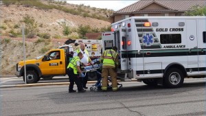 A driver of a Ford Explorer involved in an accident Tuesday is loaded into an ambulance, St. George, Utah, Oct. 27, 2015 | Photo by Ric Wayman, St. George News