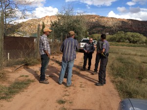 From left, Andrew Chatwin and Patrick Pipkin speak with Hildale-Colorado City Marshal's Office responder and a deputy from the Mohave County Sheriff's Office, Colorado City, Arizona, Oct. 18, 2015 | Photo by Cami Cox Jim, St. George News