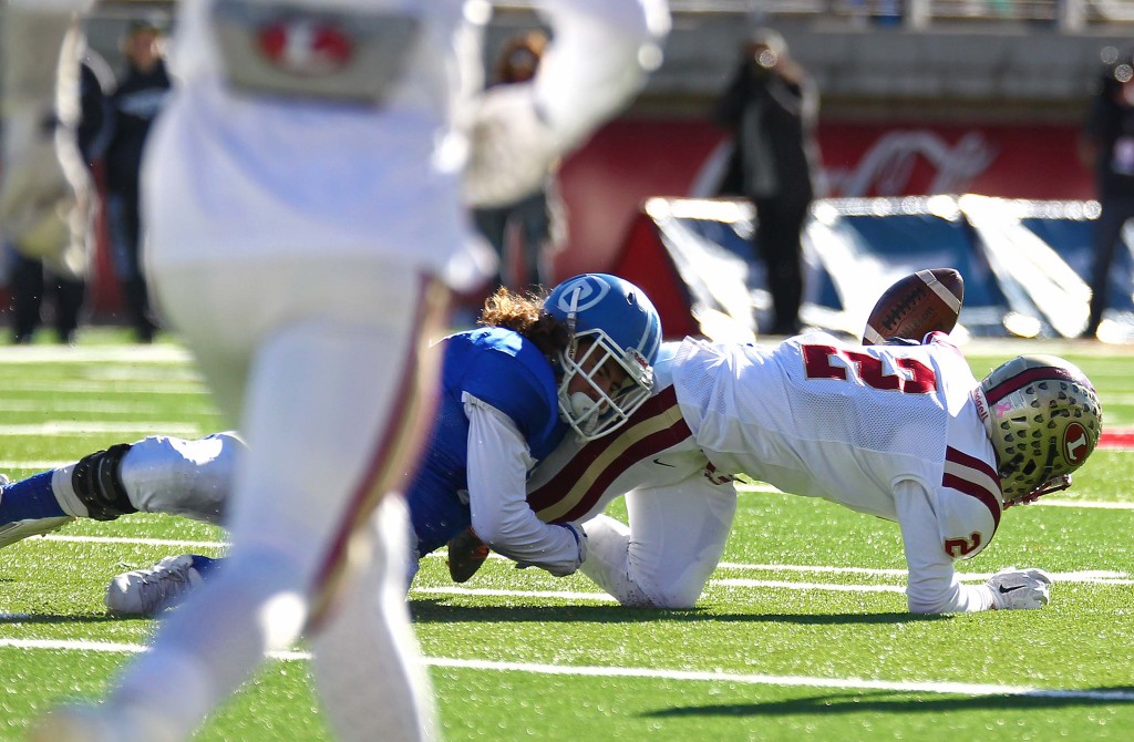 Logan's Spencer Corbett (2) fumbles the ball, Dixie vs. Logan, 3AA State Football Championship, Salt Lake City, Utah, Nov. 20th, 2015, | Photo by Robert Hoppie, ASPpix.com, St. George News