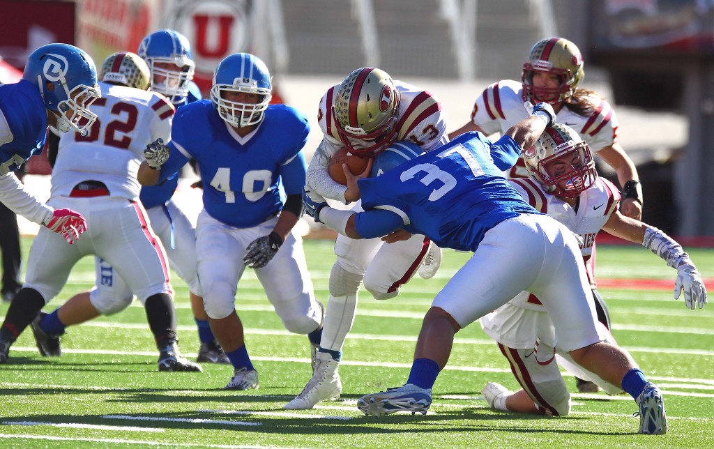 Dixie's  Malakai Fakahua (37) makes a tackle, Dixie vs. Logan, 3AA State Football Championship, Salt Lake City, Utah, Nov. 20th, 2015, | Photo by Robert Hoppie, ASPpix.com, St. George News