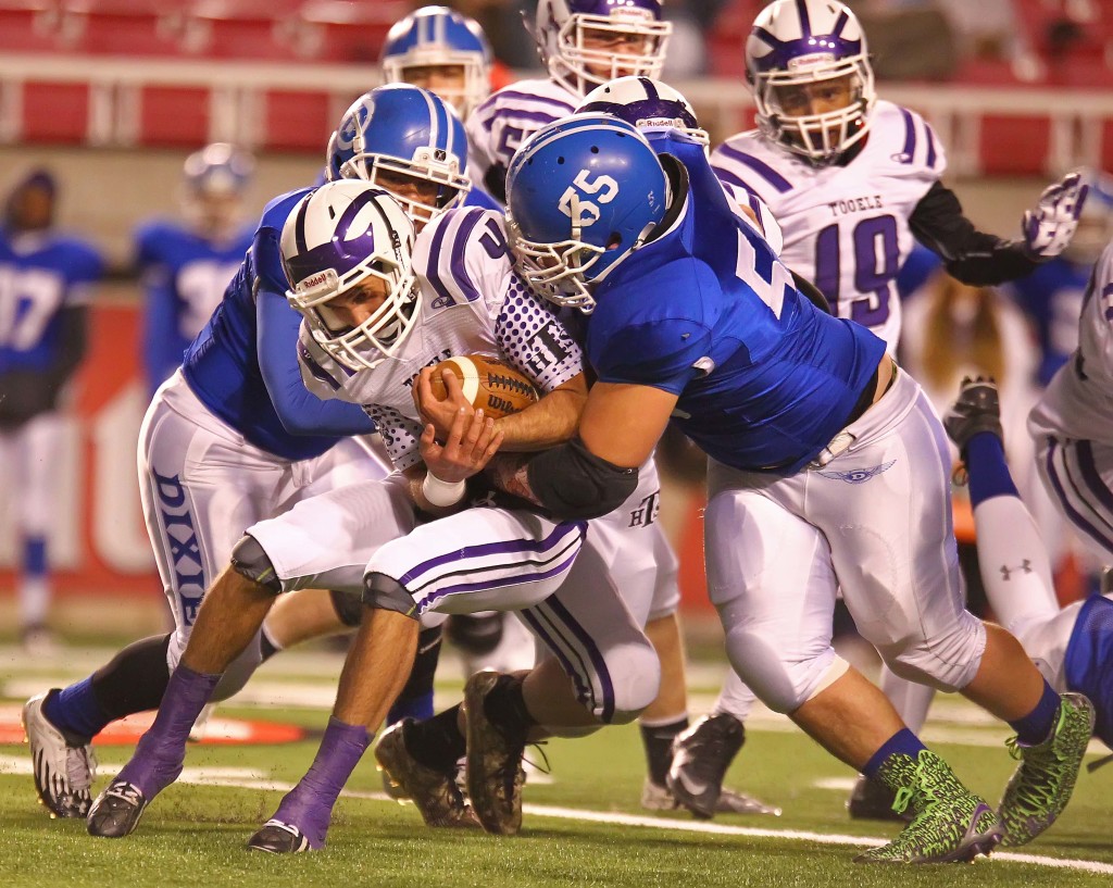 Dixie's  Jeff Martinez (55) brings down the Tooele quarterback, Dixie vs. Tooele, 3AA Football Semifinals, Salt Lake City, Utah, Nov. 13th, 2015, | Photo by Robert Hoppie, ASPpix.com, St. George News