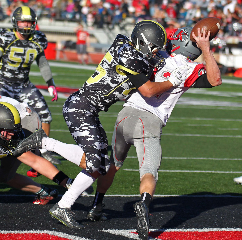 Diamond Ranch's Trevor Alvarez (15) puts a hit on Kanab's Layne Anderson (22) in the end zone, Diamond Ranch Academy vs. Kanab, 1A Football State Finals, Cedar City, Utah, Nov. 14th, 2015, | Photo by Robert Hoppie, ASPpix.com, St. George News