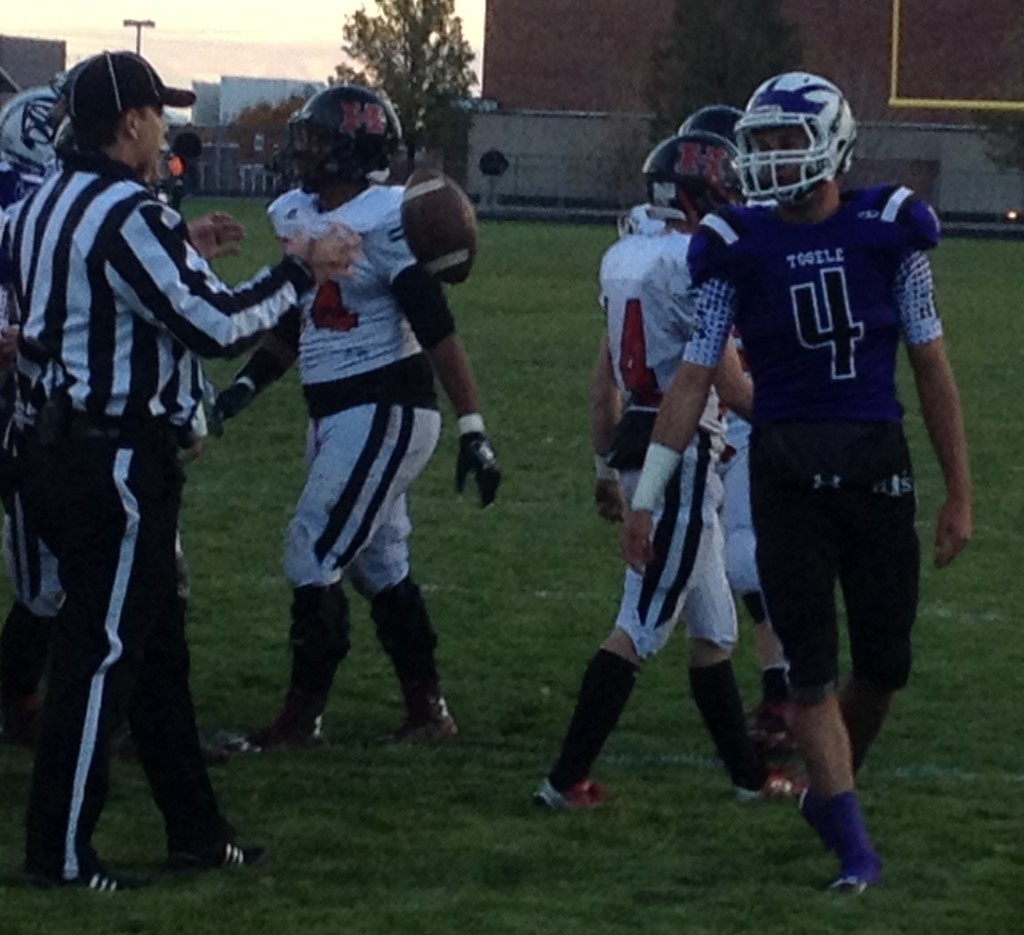 Tooele's Ryan Brady (4) tosses the ball to the referee after scoring on a long kick return, Hurricane at Tooele, Tooele, Utah, Nov. 6, 2015 | Photo by AJ Griffin, St. George News