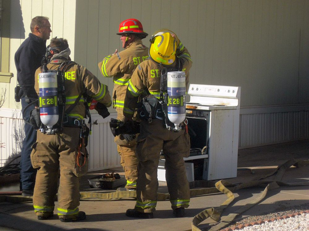 Firefighters remove an oven and burned turkey from a residence on Dixie Downs Road, St. George, Utah, Nov. 26, 2015 | Photo by Ric Wayman, St. George News