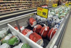 In this Nov. 5, 2015, photo, Thanksgiving turkeys are shown at a Cub Foods store in Bloomington, Minn. Richard Volpe, a retail food price economist formerly with the U.S. Department of Agriculture, said one of the most effective things supermarkets can do to lure holiday shoppers is to advertise cheap turkeys whose prices tend to be lowest around the holidays when demand is highest. Bloomington, Minnesota, November 5, 2015 | AP Photo by Jim Mone, St. George News