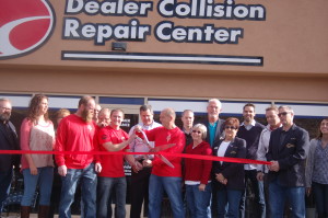 Employees of the Dealer Collision Repair Center and St. George Mayor Jon Pike join members of the St. George Chamber of Commerce as well as the Dixie Sunshiners in a ribbon cutting ceremony celebrating the opening of the new Dealer Collision facility, St. George, Utah, Dec. 4, 2015 | Photo by Hollie Reina, St. George News