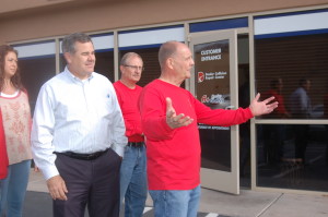 Mayor Pike (L) and Dealer Collision Repair Center General Manager Jesse Thompson (R) stand at the entrance to the office of the new Dealer Collision Location, St. George, Utah, Dec. 4, 2015 | Photo by Hollie Reina, St. George News