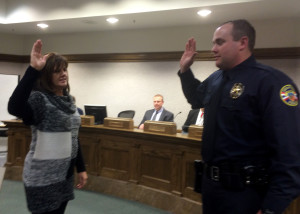 Cedar City Recorder Renon Savage officiates the swearing in of Bryan Moore as part of the Cedar City Police Department, Council Chambers, Cedar City, Utah, Dec. 17, 2015 | Photo by Carin Miller St. George News