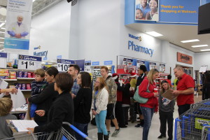 Volunteers flood into Bloomington Wal-Mart to shop for needy family through KONY Coins for Kids, St. George, Utah, Dec. 16, 2015| Photo by Cody Blowers