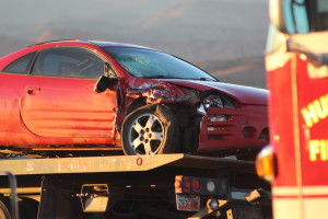 Red Mitsubishi Eclipse damaged in collision on West State Street, Hurricane, Utah, Dec. 24, 2015 | Photo by Cody Blowers, St. George News