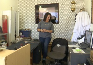 St. George store ReDiscovered Treasures owner Diane Bolding looks at counter area where burglars struck over Christmas, St. George, Utah, Dec. 27, 2015 | Photo by SHeldon Demke, St. George News