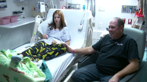 Megan Rowley, 14, and her father, John Rowley. Megan was sent to the hospital after collapsing at Dixie Middle School and going into cardiac arrest. The Rowley family and others credit the actions of School Resource Officer Matt Schuman with saving the teen's life by giving her CPR until the ambulance arrived, St. George, Utah, Dec. 11, 2015 | Photo courtesy of Fox 13 News, St. George News