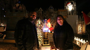 Frank and Kim Kuhn standing standing by the trophy their “Christmas Spectacular” won on ABC's “The Great Christmas Light Fight,” St. George, Utah, Dec. 7, 2015 | Photo by Mori Kessler, St. George News