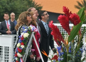 After placing a wreath, daughters and sons of astronauts who have died look up at the names of their loved ones on the Astronaut Memorial during a Day of Remembrance Ceremony on the 30th anniversary of the 1986 space shuttle Challenger tragedy. From foreground are Sheryl Chaffee, daughter of Apollo 1 astronaut Roger Chaffee who died in the Apollo 1 fire on Jan. 27, 1967; Kathie Scobee Fulgham and Air Force Maj. Gen. Richard Scobee, children of Challenger commander Dick Scobee who died on Jan. 28, 1986; and Scott McAuliffe, son of Challenger schoolteacher Christa McAuliffe. Kennedy Space Center Visitor Complex, Jan. 28, 2016 | Photo by Tim Shortt for Florida Today via AP, St. George News