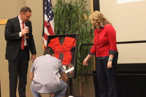 Kris Paronto examines the memorabilia case given to him by DSU at the Gardner Center Ballroom on Jan. 25, 2016. | Photo by Don Gilman, St. George News