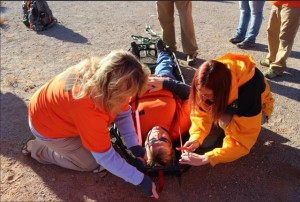 Red Rocks Search and Rescue St. George branch learning to tie a victim into a stokes litter during training, St. George, Utah, November 2015 | Photo courtesy of Red Rocks Search and Rescue, St. George News