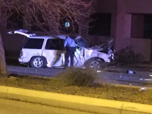 Officer checking on driver after rollover on South Mall Drive, St. George, Utah, Jan. 23, 2016| Photo courtesy of Patrick Amico, St. George News